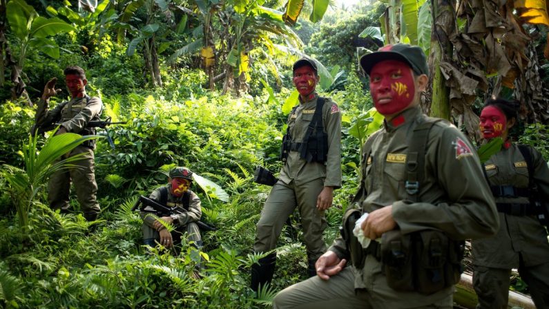 This photo taken on July 30, 2017 shows guerrillas of the New People's Army (NPA) resting among bushes in the Sierra Madre mountain range, located east of Manila. NOEL CELIS/AFP/Getty Images