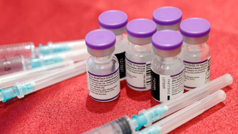 Syringes and vials of the Pfizer-BioNTech vaccine against the coronavirus are pictured at a private nursing home in the Israeli central coastal city of Netanya on January 5, 2022. - Israel began on January 3 administering fourth Covid vaccine shots to people over 60 and health workers amid a surge driven by the Omicron variant. (Photo by JACK GUEZ / AFP) (Photo by JACK GUEZ/AFP via Getty Images)